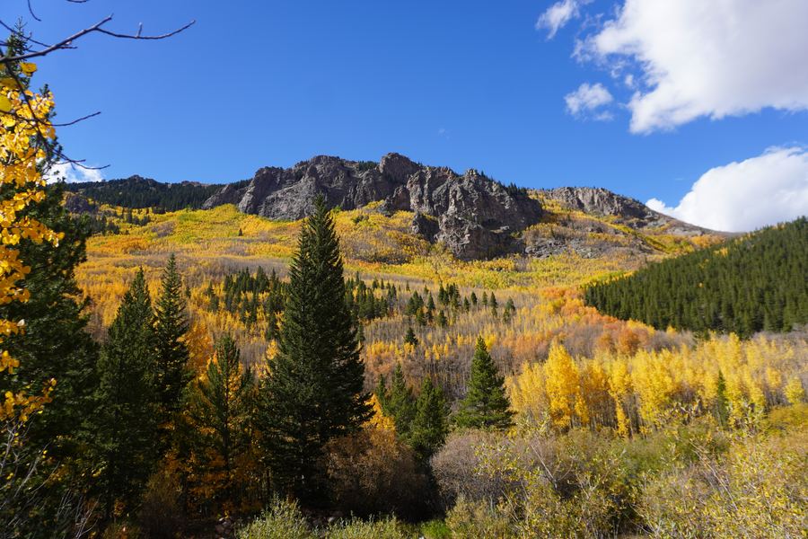 Craggy ridge above a valley of gold and green